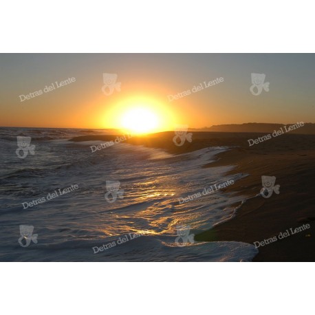 Reflejos de una Puesta de Sol sobre la costa